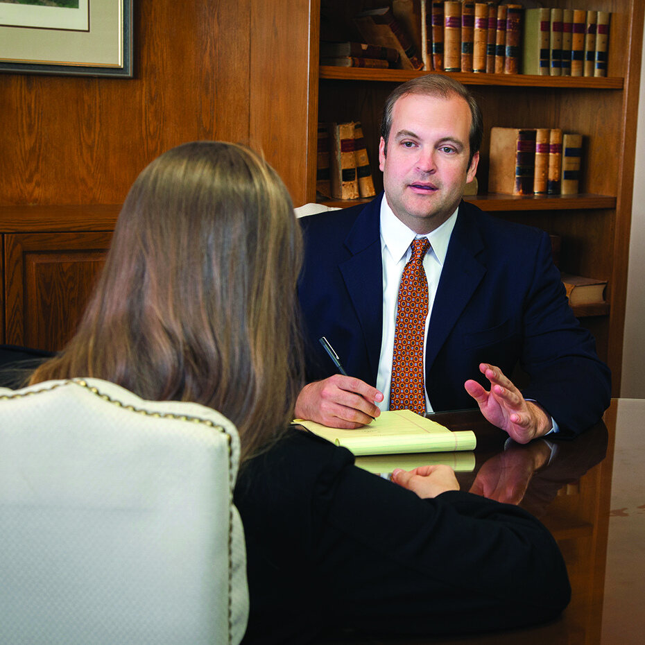 Brandon Martin meeting with a client at the conference table